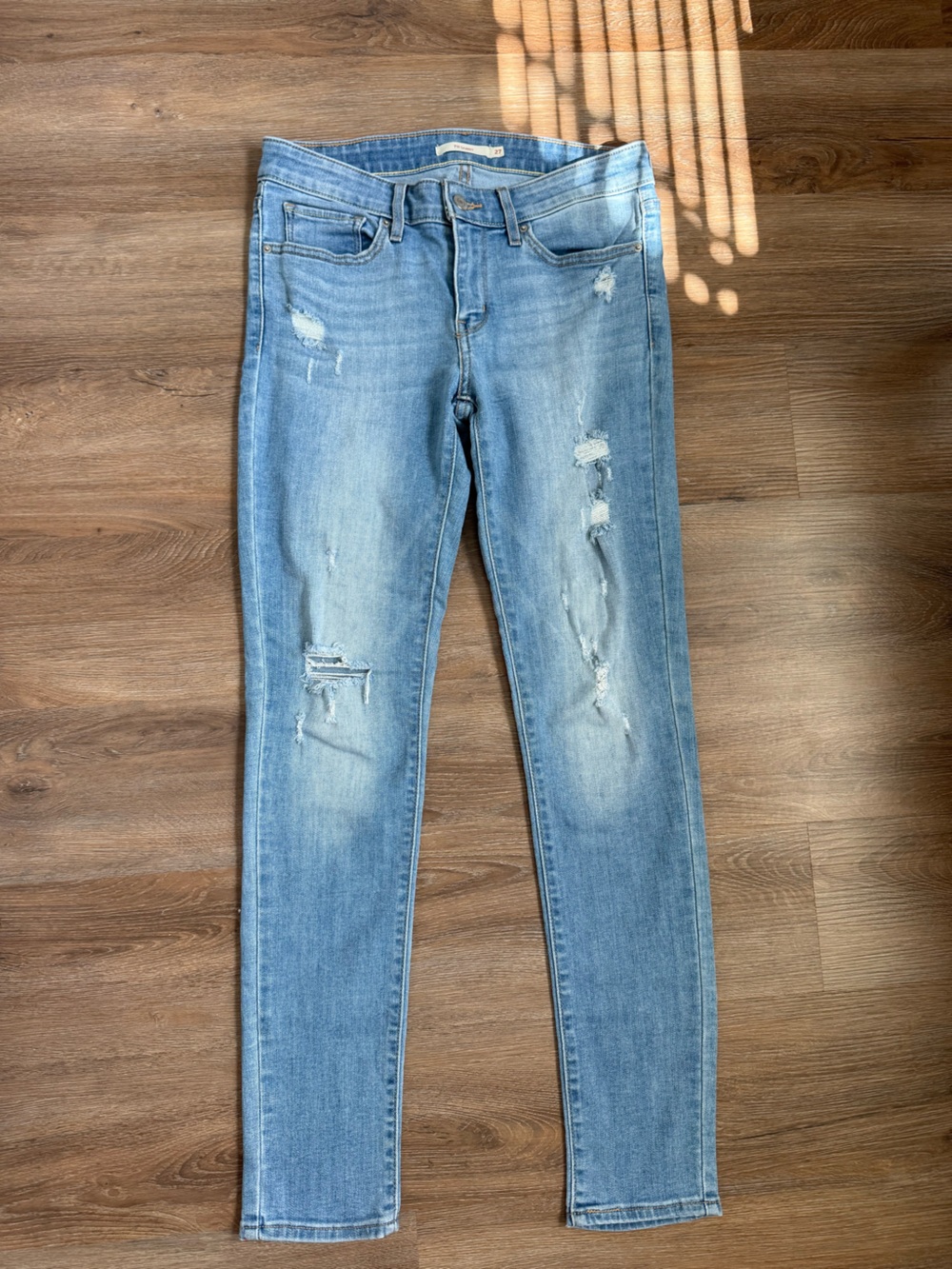 Leviโs Light Blue Distressed Womenโs Skinny Jeans